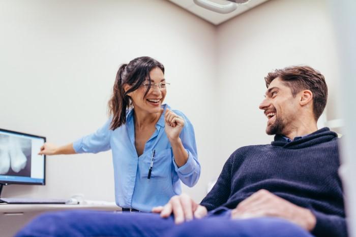 dentist and patient in exam room