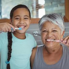 people brushing teeth